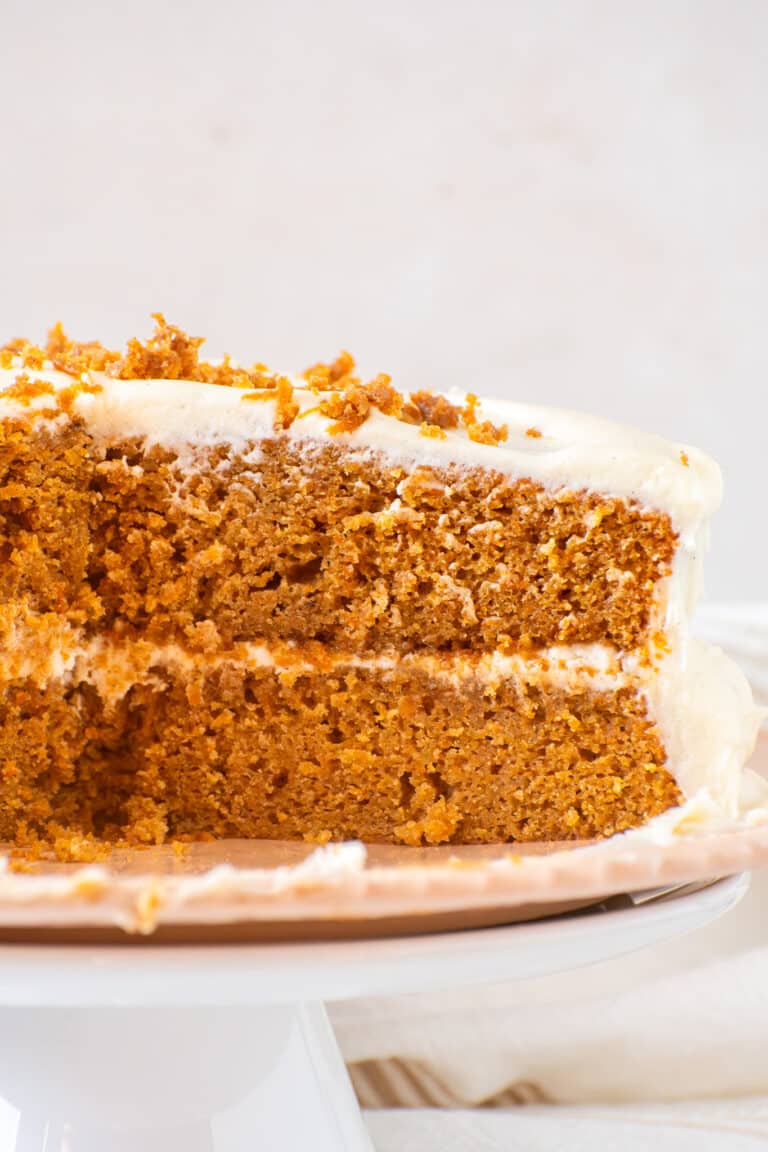 Moist one bowl carrot cake with cream cheese frosting showing soft carrot cake layers and tender crumb