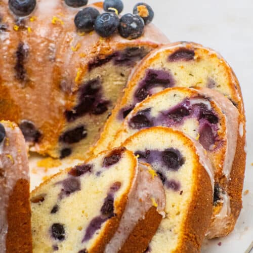 sliced lemon blueberry pound cake showing moist crumb and fresh blueberries