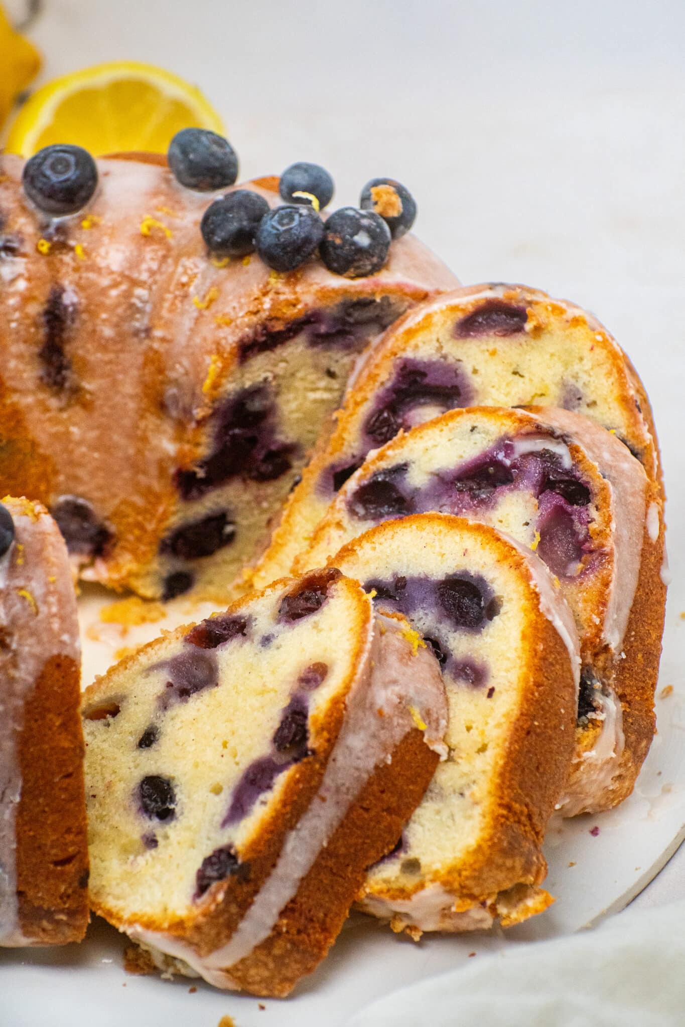 sliced lemon blueberry pound cake showing moist crumb and fresh blueberries