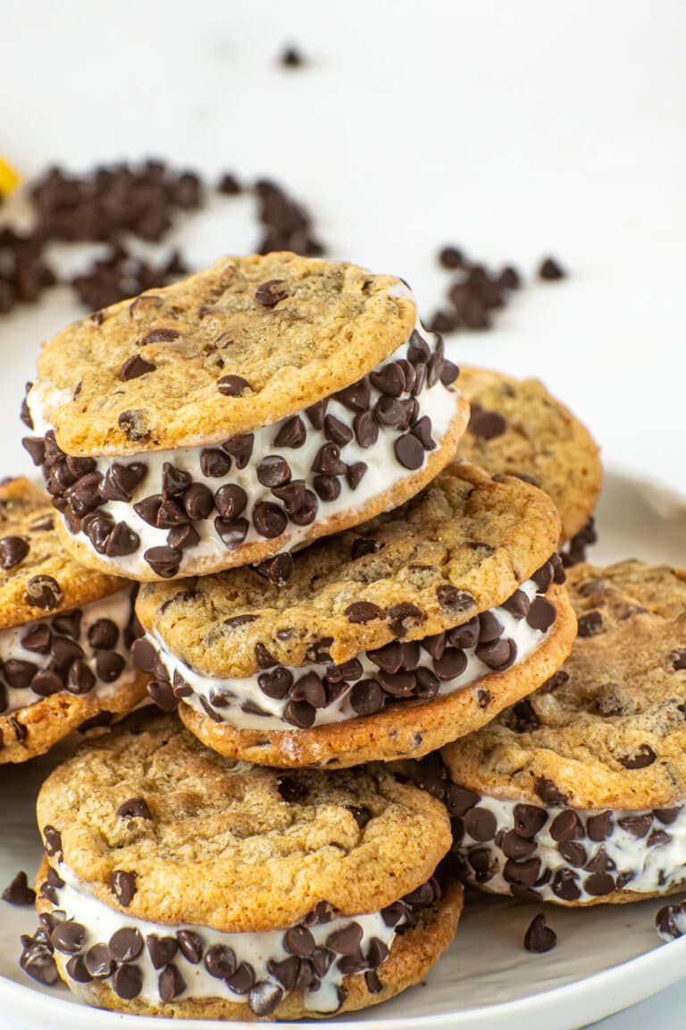 Chocolate chip cookie ice cream sandwiches filled with vanilla ice cream and rolled in mini chocolate chips