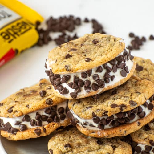Stacked chocolate chip cookie ice cream sandwiches with vanilla ice cream and mini chocolate chips