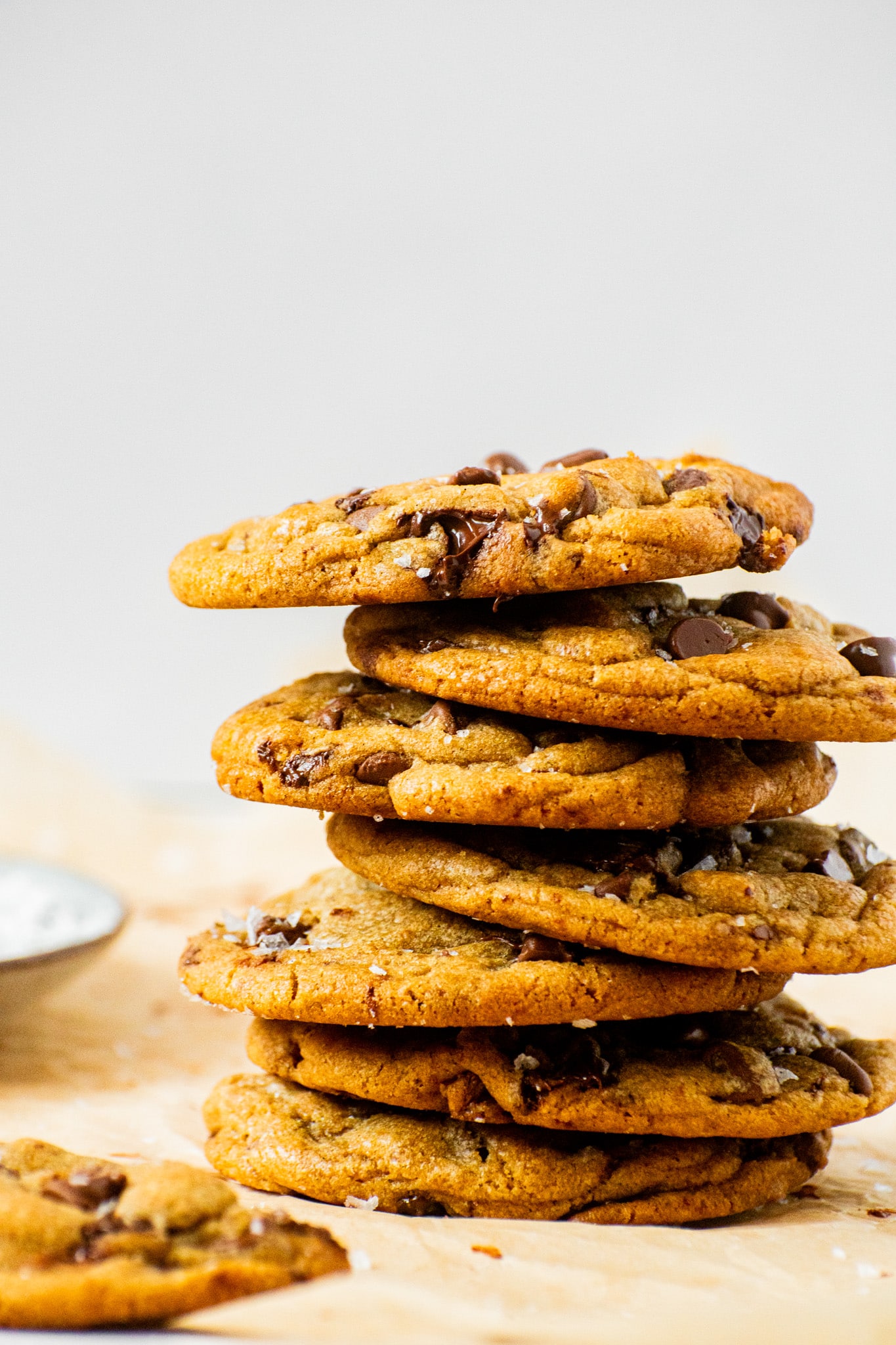 Stack of chewy chocolate chip cookies with crisp edges and melted chocolate chips