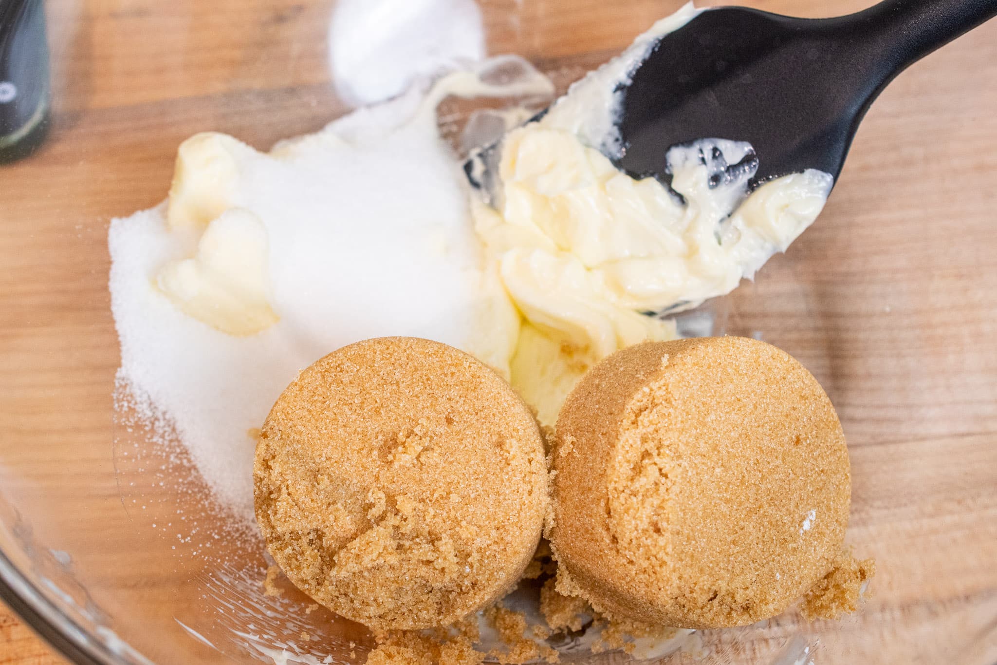 Butter and brown sugar in a bowl ready to be mixed.