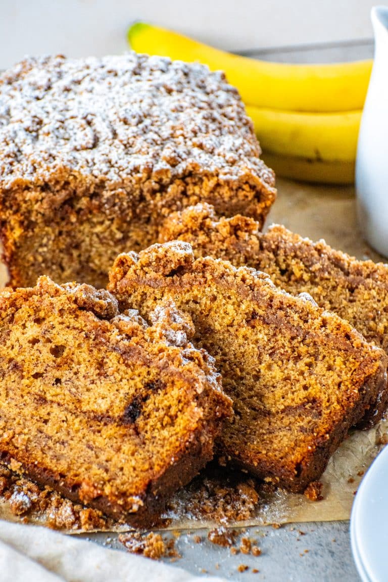 Moist coffee cake banana bread slices with cinnamon swirl and streusel crumb topping
