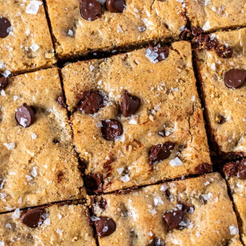 Sliced chocolate chip blondies topped with flaky salt and melty chocolate chips