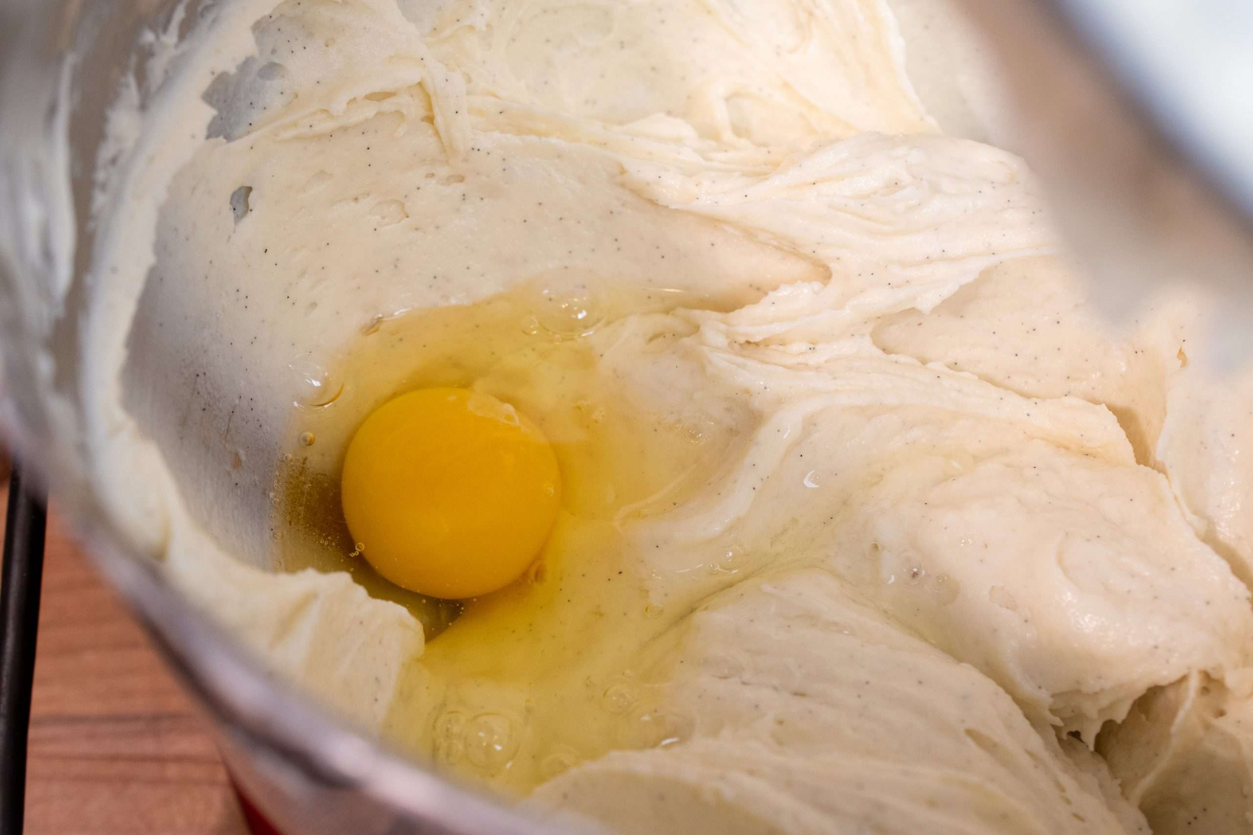 Adding eggs to the cheesecake batter for richness and structure