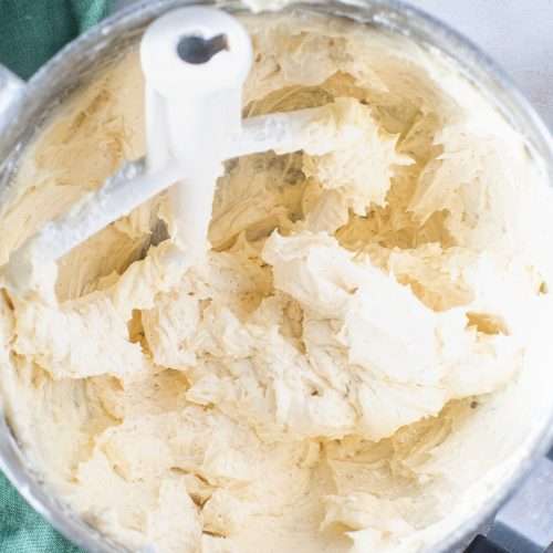 Fluffy vegan buttercream in a stand mixer bowl with paddle attachment, ready for decorating.