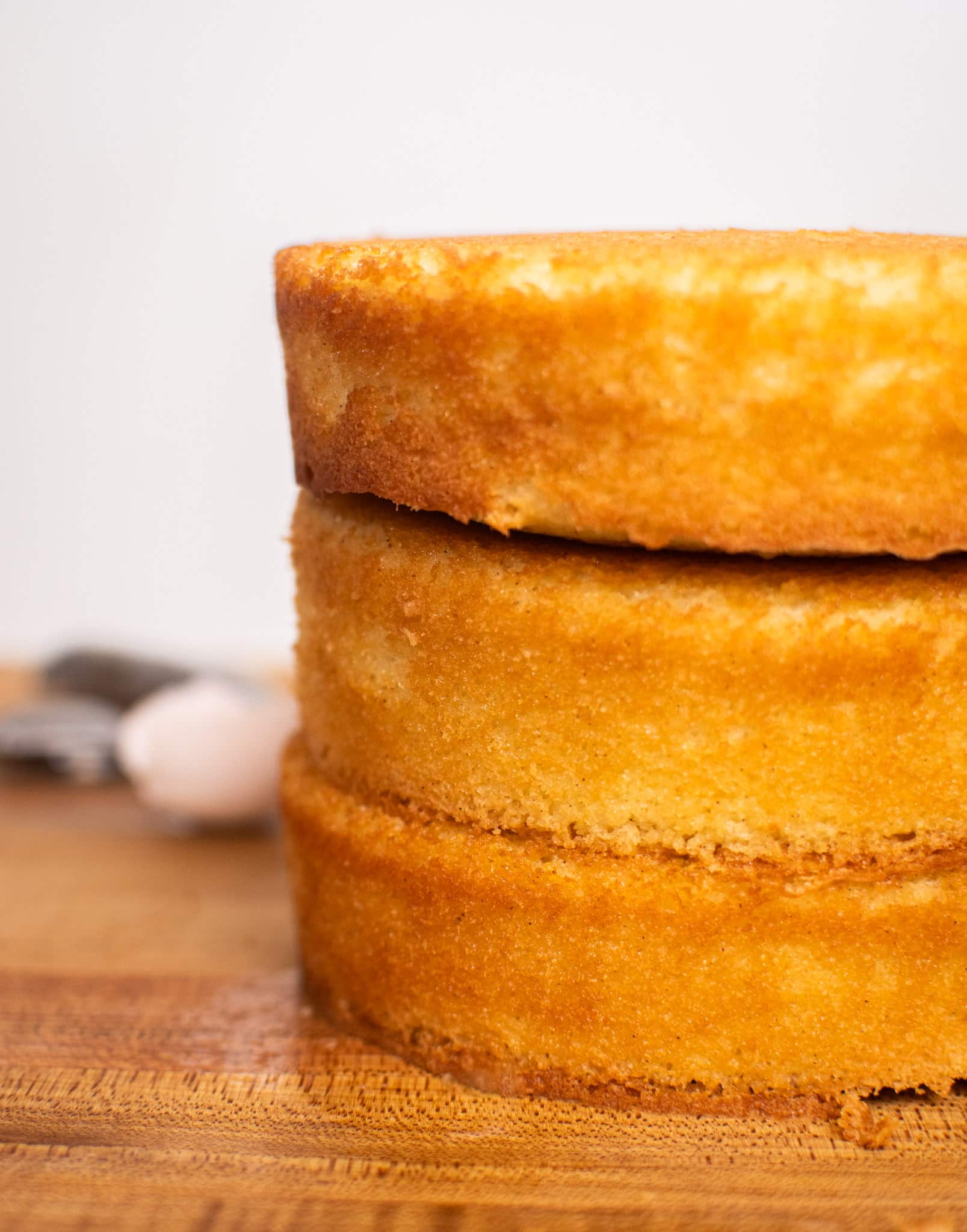 Three stacked cake layers baked to golden perfection