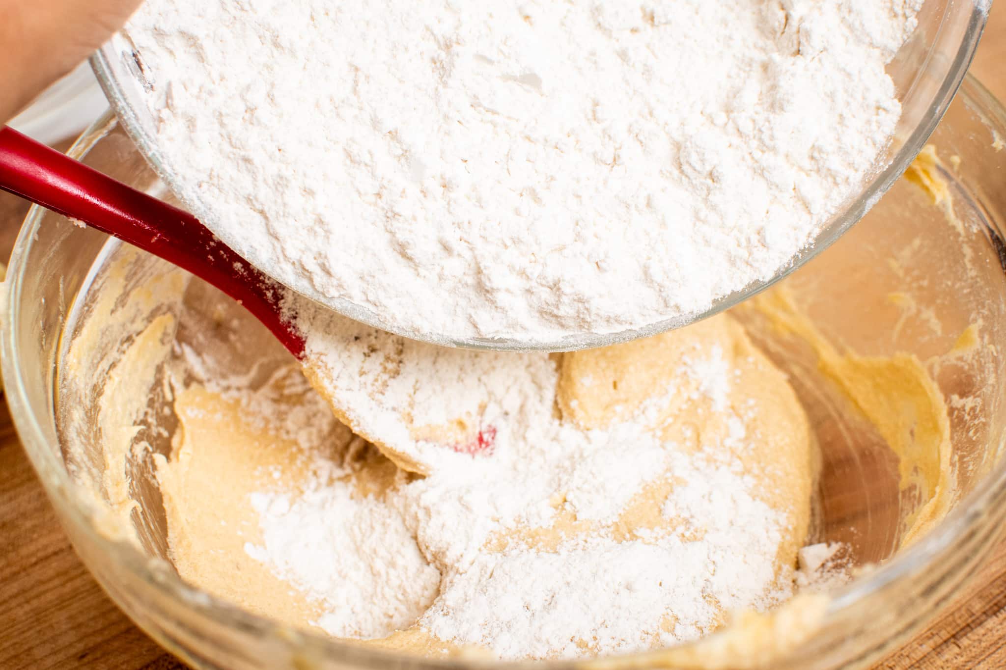 Adding in the dry ingredients to the butter mixture.