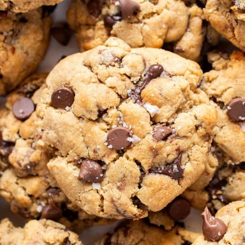Close-up of peanut butter chocolate chip cookies with melty chocolate and sea salt on top