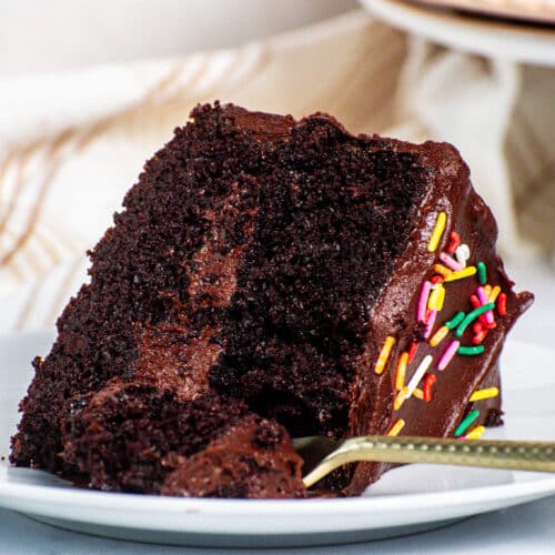 Cooled chocolate cake slice ready to be frosted with fudgy chocolate frosting