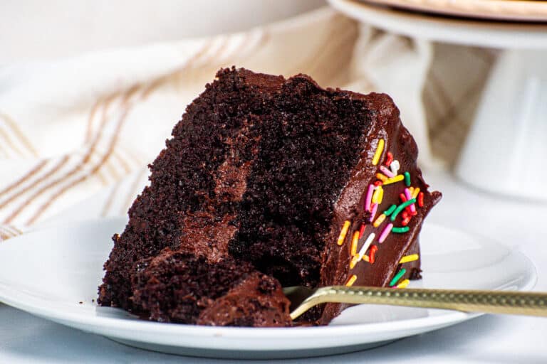 Cooled chocolate cake slice ready to be frosted with fudgy chocolate frosting