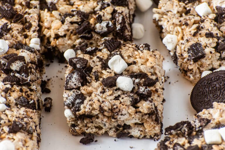 Gooey Oreo Rice Krispie Treats topped with chopped Oreos and mini marshmallows